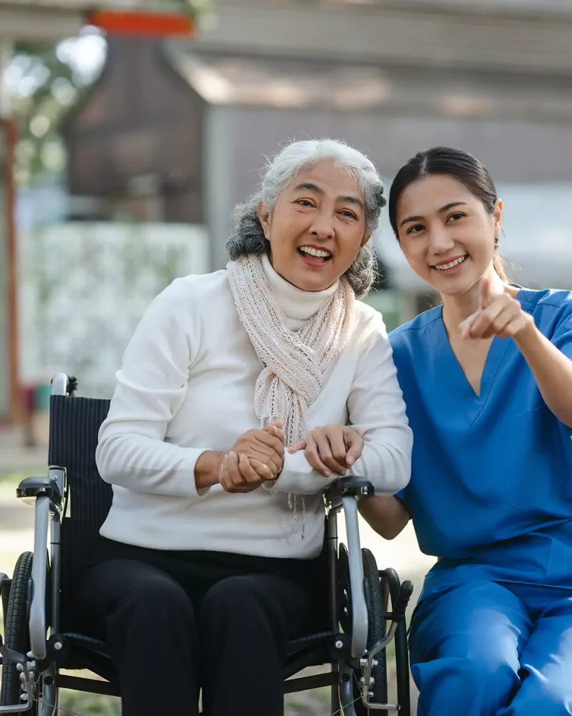 Disabled woman in wheelchair with nurse
